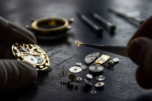 Professional watch repair technician fixing a luxury watch at Busy Bee Jewelry in Massapequa, NY